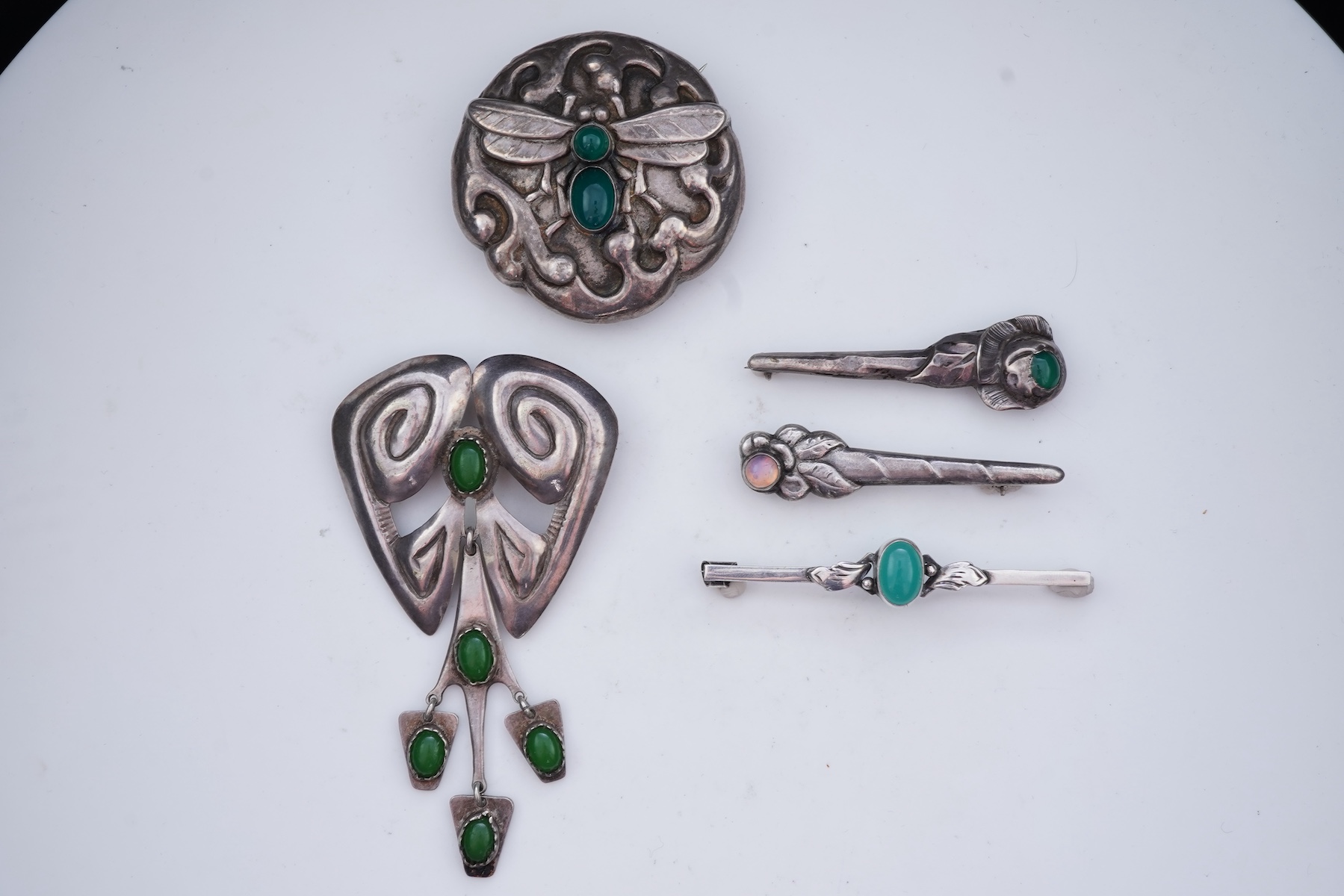A collection of five Arts & Crafts silver brooches, Denmark, early-mid 20th century